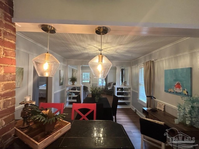 dining area featuring dark hardwood / wood-style flooring and ornamental molding