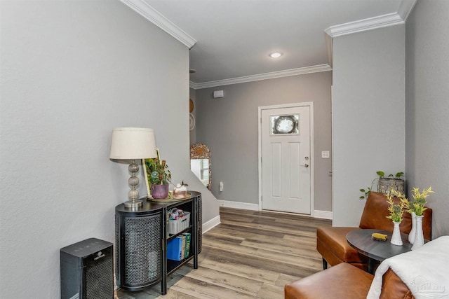 entrance foyer featuring crown molding and wood-type flooring