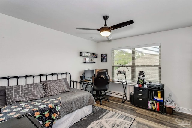 bedroom featuring hardwood / wood-style flooring and ceiling fan