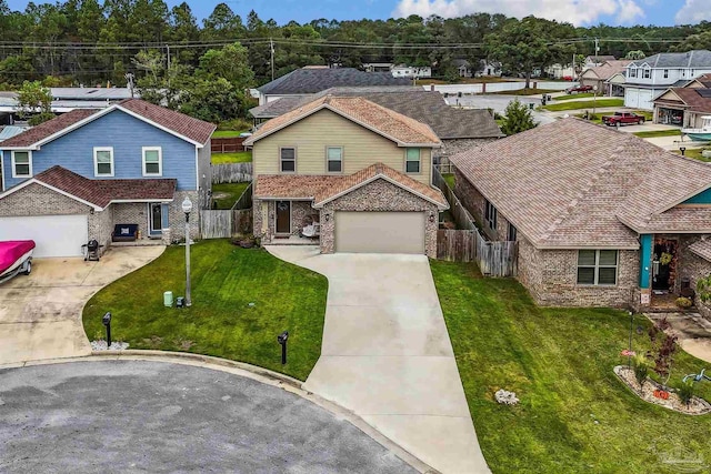 view of front of house featuring a front yard and a garage