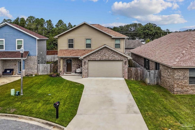 view of property with a garage and a front lawn