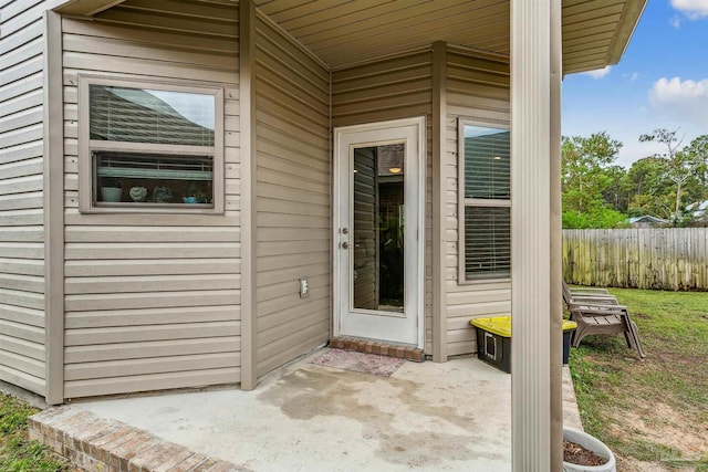 entrance to property with a patio area