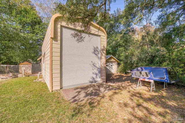 view of property exterior featuring a lawn and a storage shed