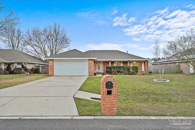 view of front of property featuring a garage and a front yard