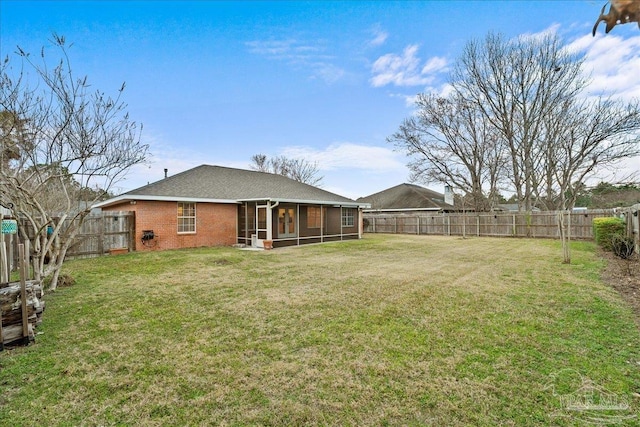 view of yard with a sunroom