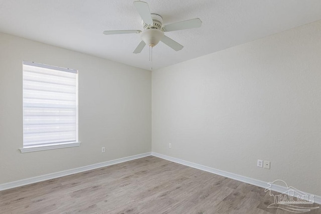 unfurnished room featuring ceiling fan and light hardwood / wood-style flooring