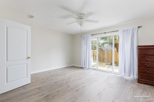 spare room featuring ceiling fan and light hardwood / wood-style floors