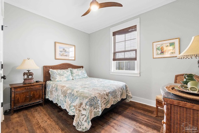 bedroom with a ceiling fan, baseboards, and dark wood-style flooring