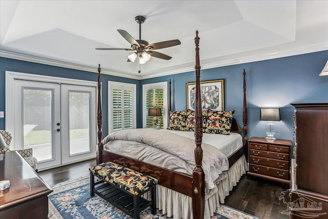 bedroom featuring multiple windows, access to outside, french doors, and wood finished floors