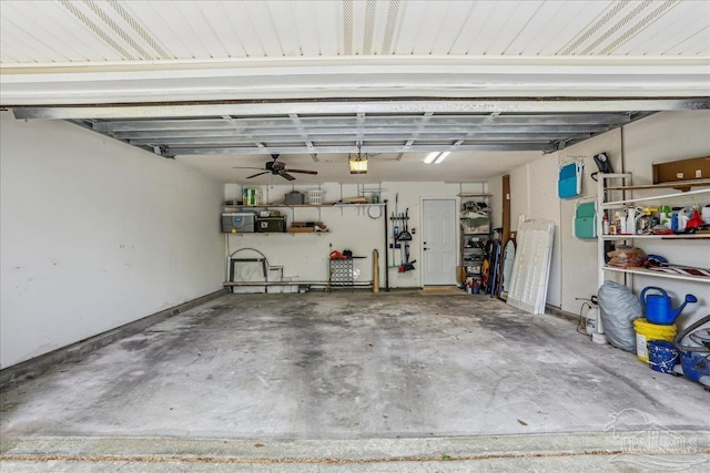 garage with electric panel, a ceiling fan, and a garage door opener