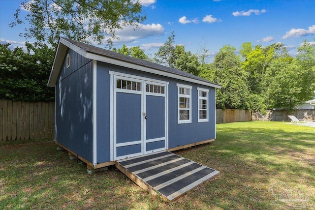 view of shed with a fenced backyard