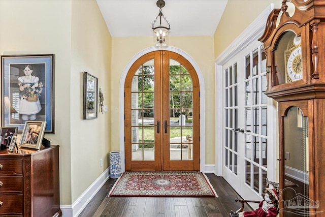 entryway featuring dark wood finished floors, baseboards, and french doors