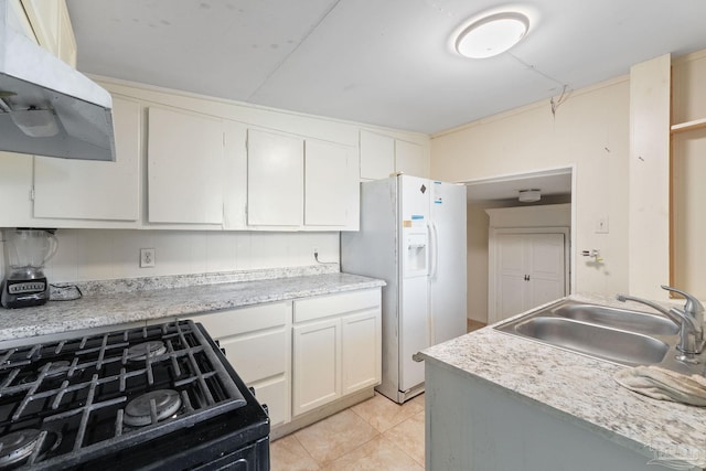 kitchen featuring white cabinets, sink, exhaust hood, white refrigerator with ice dispenser, and black range oven