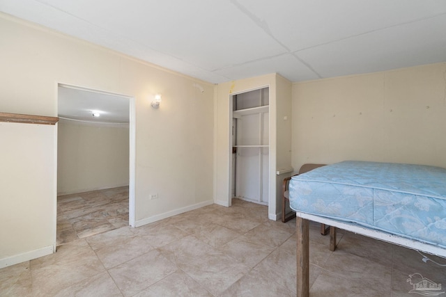 bedroom featuring a paneled ceiling