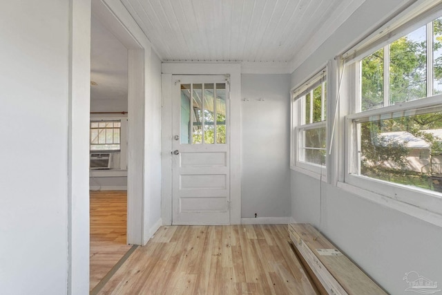doorway with cooling unit, wooden ceiling, and light wood finished floors