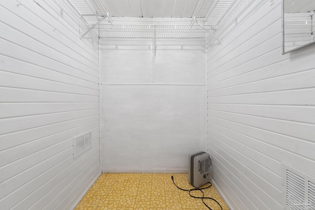 walk in closet with tile patterned floors