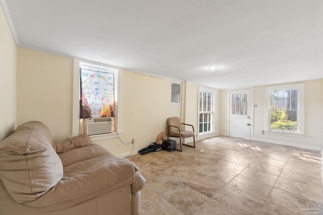 living room featuring crown molding, electric panel, and cooling unit