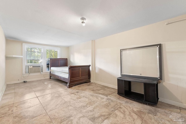 unfurnished bedroom with cooling unit and a textured ceiling