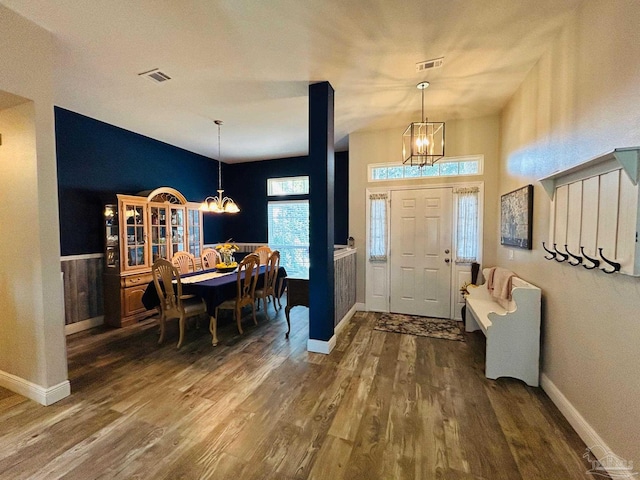 foyer featuring a chandelier and dark hardwood / wood-style flooring