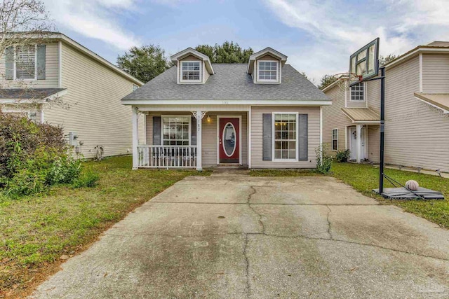 view of front of house with covered porch and a front yard