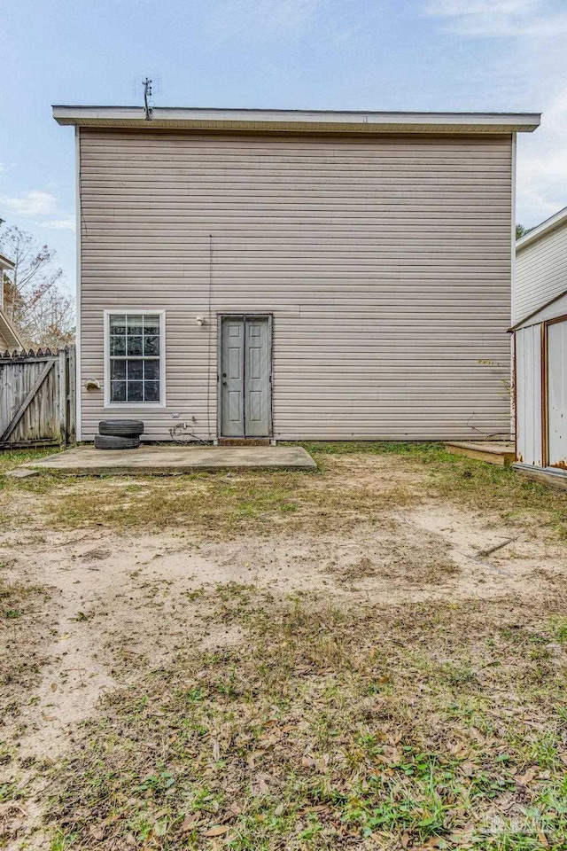 back of house with a patio area