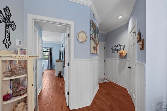 hall featuring hardwood / wood-style flooring and crown molding