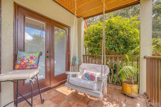 sunroom featuring french doors