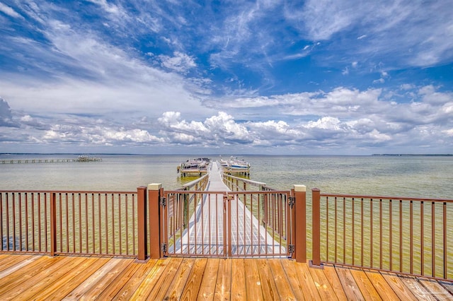 wooden deck featuring a water view