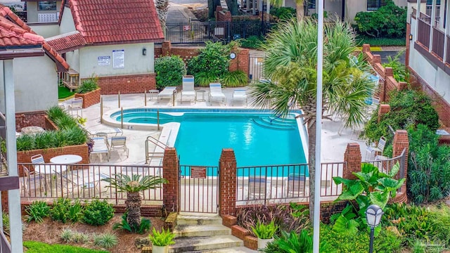 view of swimming pool with a patio area