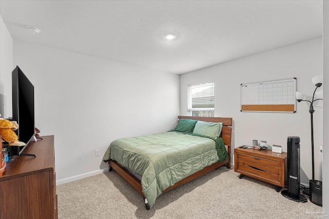 bedroom featuring light carpet