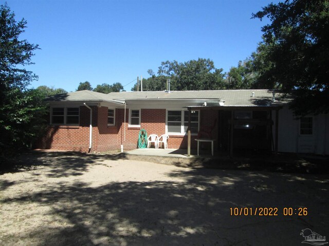 back of house with a patio area