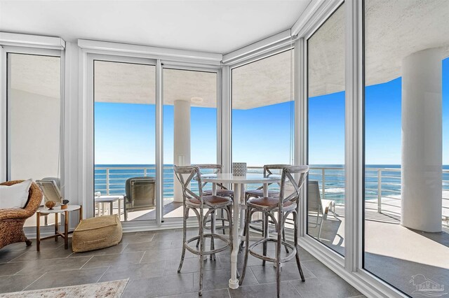 13335 Johnson Beach Rd Unit 1003, Pensacola, FL 32507 - sunroom / solarium with a water view and a view of the beach