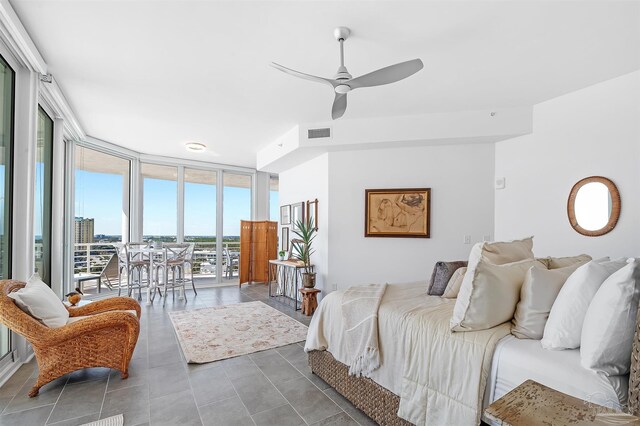 13335 Johnson Beach Rd Unit 1003, Pensacola, FL 32507 - tiled bedroom featuring access to exterior, floor to ceiling windows, and ceiling fan