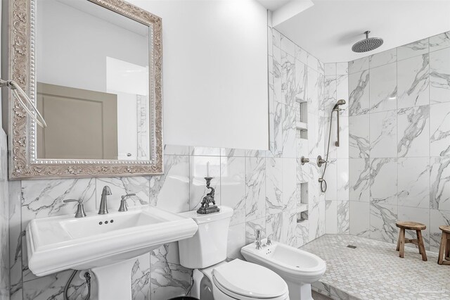 13335 Johnson Beach Rd Unit 1003, Pensacola, FL 32507 - bathroom featuring sink, toilet, tile walls, tiled shower, and a bidet