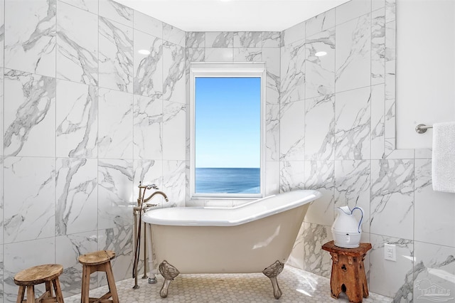 13335 Johnson Beach Rd Unit 1003, Pensacola, FL 32507 - bathroom with tile walls, a washtub, and a water view