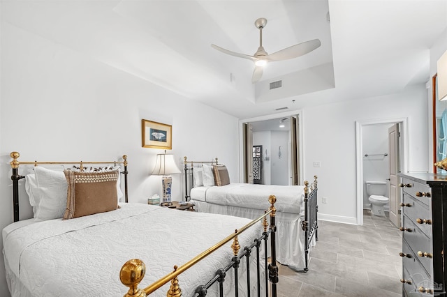 13335 Johnson Beach Rd Unit 1003, Pensacola, FL 32507 - bedroom with a tray ceiling, connected bathroom, and ceiling fan