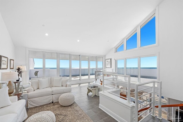 13335 Johnson Beach Rd Unit 1003, Pensacola, FL 32507 - living room featuring high vaulted ceiling and a water view