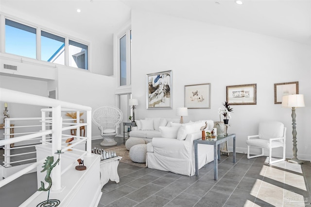 13335 Johnson Beach Rd Unit 1003, Pensacola, FL 32507 - living room featuring a high ceiling and dark tile patterned floors