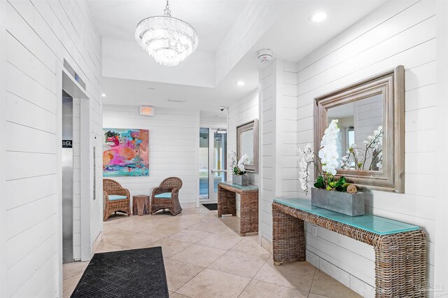 13335 Johnson Beach Rd Unit 1003, Pensacola, FL 32507 - hall featuring an inviting chandelier and light tile patterned floors