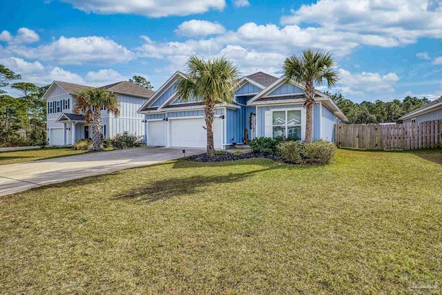 view of front of home featuring a front yard and a garage