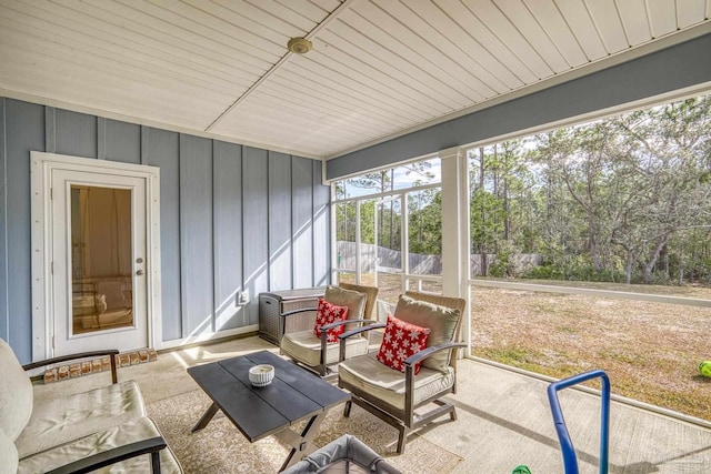 sunroom / solarium featuring wood ceiling