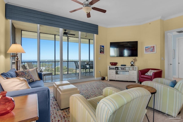 carpeted living room featuring expansive windows, ornamental molding, a water view, and ceiling fan