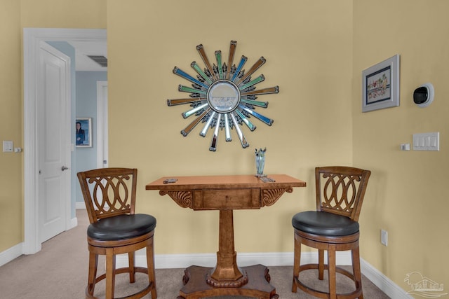 view of carpeted dining space