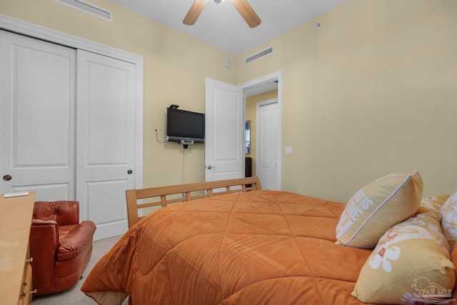 carpeted bedroom with a closet and ceiling fan