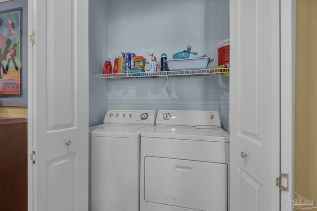 washroom featuring washing machine and dryer