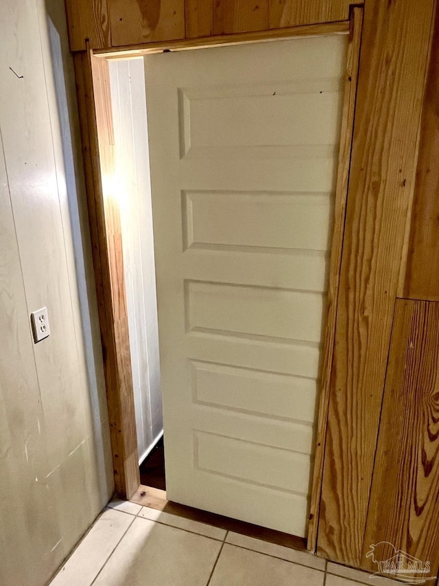 doorway to outside featuring light tile patterned flooring