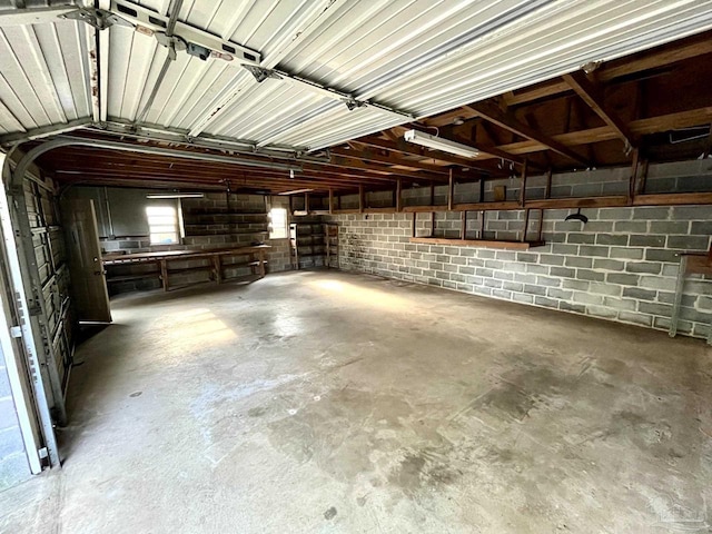 garage with concrete block wall