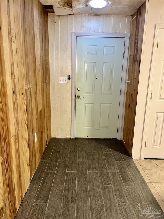 interior space featuring wood walls