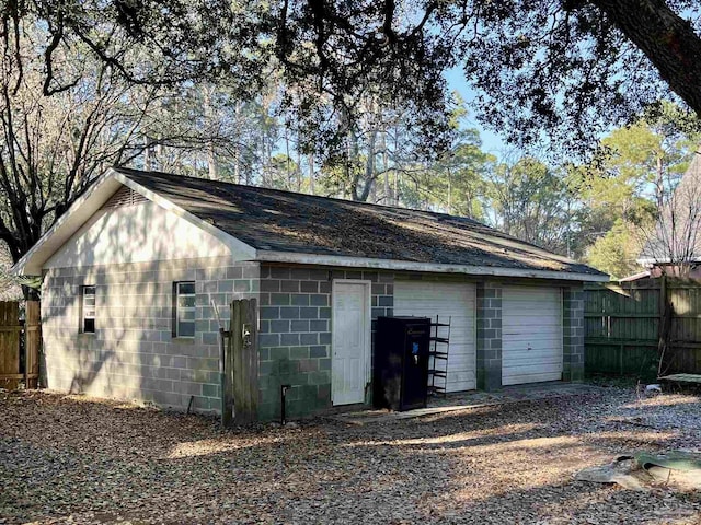 garage featuring fence