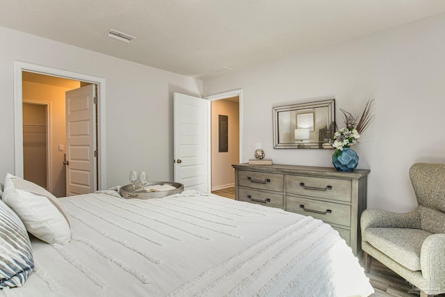 bedroom with hardwood / wood-style floors